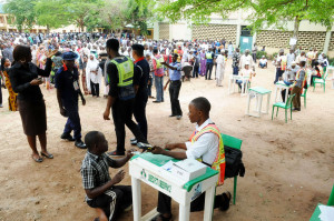 PIC. 4. A PHYSICALLY CHALLENGED VOTER BEING ACCREDITED AT GARKI PRIMARY SCHOOL  POLLING UNIT IN ABUJA ON SATURDAY (28/3/15). 1653/28/3/2015/ZI/BJO/NAN