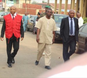 Professor Adebiyi Daramola and the Bursar of the university, Mr Emmanuel Oresegun entering the court premises 