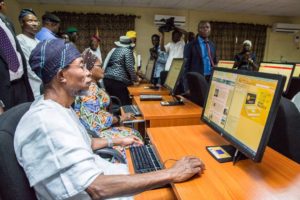 Governor Aregbesola Browses Through One Of The Computers After Commissioning The Judicial Research Center