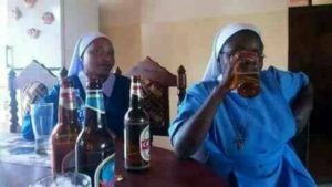 Reverend Father drinks beer 
