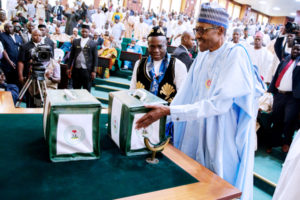 President Muhammadu Buhari (right) with Senator Ita Enang, Senior Special Assistant to the President on National Assembly Matters (Senate), during the president’s presentation of the 2018 budget to the joint session of the National Assembly in Abuja on Tuesday. PHOTO: JIDE OYEKUNLE