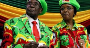 Zimbabwean President Robert Mugabe and his wife Grace attend a meeting of his ruling ZANU PF party's youth league in Harare