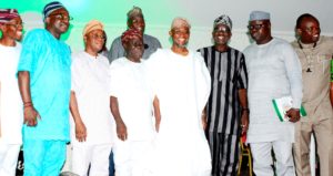 Governor State of Osun, Ogbeni Rauf  (middle); Commissioner for Information & Strategy, Mr. Adelani Baderinwa(4th left), Chief of Staff to the Governor, Alhaji Gboyega Oyetola (3rd left), Special Adviser to the Governor on Information and Strategy, Mr Semiu Okanlawon (2nd right), Commissioner for Education, Mr. Kola Omotunde-Young (left), Commissioner for Innovation, Science and Technology, Mr. Remi Omowaiye (right) and others, during the presentation of Golden Merit Award to Governor Aregbesola for unprecedented Infrastructural Development, at the atlantis Civic Centre, Osogbo on Thursday 19-04-2018