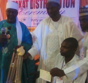 Presentation of cheque to one of the Beneficiaries 